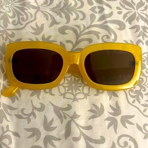 Beautiful yellow sunglasses ready to hit the beach